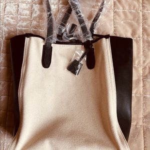 NEW: Leather & Canvas Tote
Height: 13.5 inches
Width: 7.5 inches